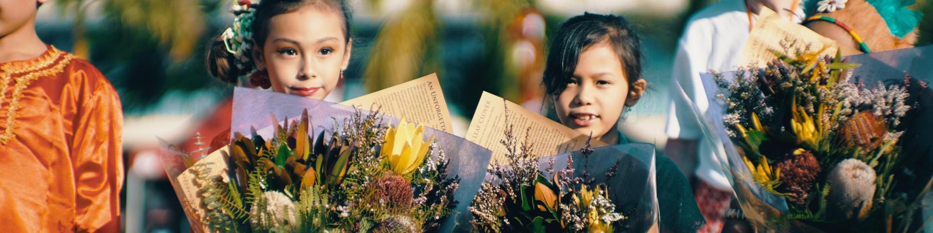 Children holding flowers