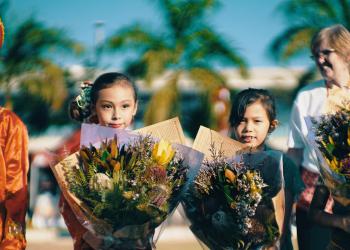 Children holding flowers