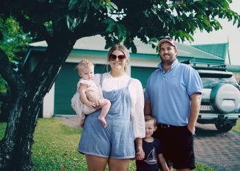Family in front of their house